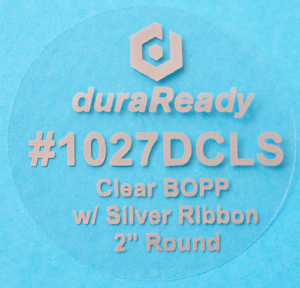 #1027DCLS, 2" round clear BOPP with silver ribbon.